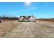 Front exterior showcasing a modern farmhouse with large lot and newly installed driveway at 520 Shoal Rd, Lincolnton, NC 28092
