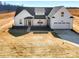 New construction home featuring farmhouse design with prominent gables and an attached garage at 520 Shoal Rd, Lincolnton, NC 28092