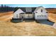 New construction home features a modern farmhouse design and attached two car garage at 520 Shoal Rd, Lincolnton, NC 28092
