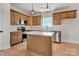 Modern kitchen featuring an island, stainless steel appliances, and pendant lighting at 520 Shoal Rd, Lincolnton, NC 28092