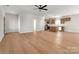 Open-concept living room and kitchen with hardwood floors and modern lighting at 520 Shoal Rd, Lincolnton, NC 28092