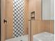 Modern shower featuring stylish tile and a built in shower caddy at 520 Shoal Rd, Lincolnton, NC 28092