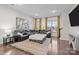 Bright, open living area featuring plush seating and a modern decorative rug at 824 Imperial Ct, Charlotte, NC 28273