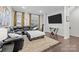 Spacious living room featuring dark leather furniture and stylish decor at 824 Imperial Ct, Charlotte, NC 28273