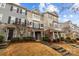 Charming townhomes boast mixed siding, stone accents, and well-maintained landscaping at 824 Imperial Ct, Charlotte, NC 28273