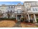 Inviting townhome exterior showcases mixed siding, stone details, and a tidy front yard at 824 Imperial Ct, Charlotte, NC 28273