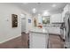 Well-lit kitchen with granite countertops, a kitchen island, and stainless steel appliances at 824 Imperial Ct, Charlotte, NC 28273