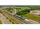 Aerial view of a commuter railway station with a passenger train approaching the platform at 824 Imperial Ct, Charlotte, NC 28273