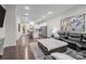 Open-concept living area flowing into a modern kitchen with stainless steel appliances at 824 Imperial Ct, Charlotte, NC 28273