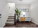 Bright entryway featuring wood floors, staircase, and decorative console table at 824 Imperial Ct, Charlotte, NC 28273