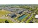 Aerial view of a townhome community, showcasing the pond and lush green landscaping at 824 Imperial Ct, Charlotte, NC 28273