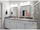 Bathroom featuring dual sinks, granite countertops, and a glass-enclosed shower at 824 Imperial Ct, Charlotte, NC 28273