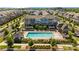 An aerial view of townhomes with a community pool, surrounded by mature trees and landscaping at 824 Imperial Ct, Charlotte, NC 28273