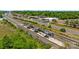Aerial view of a commuter railway station with a passenger train approaching the platform at 824 Imperial Ct, Charlotte, NC 28273