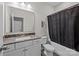 Neutral toned bathroom with a granite vanity top and a shower and bathtub combination at 824 Imperial Ct, Charlotte, NC 28273