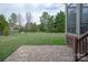 Large backyard with a brick patio and lush green lawn, perfect for outdoor living and entertaining at 841 Wandering Way Dr, Waxhaw, NC 28173