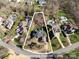Aerial view showcasing the property's location and lot lines surrounded by mature trees and landscaping at 9901 Strike The Gold Ln, Waxhaw, NC 28173