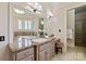 The main bathroom features a dual vanity with granite countertops, framed mirrors, and a separate tub and shower at 9901 Strike The Gold Ln, Waxhaw, NC 28173