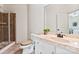 Bathroom featuring tiled shower, and vanity with marble countertop and under-sink cabinets at 9901 Strike The Gold Ln, Waxhaw, NC 28173