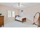 Cozy bedroom features a simple decor with natural light from a window with shutter blinds at 9901 Strike The Gold Ln, Waxhaw, NC 28173