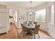 Sunlit breakfast nook with hardwood floors and large windows at 9901 Strike The Gold Ln, Waxhaw, NC 28173