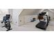 Home exercise room features a treadmill, exercise bike, and weights for fitness enthusiasts at 9901 Strike The Gold Ln, Waxhaw, NC 28173