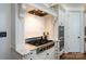 Gourmet kitchen showcasing a professional-grade gas range, tile backsplash, and custom hood at 9901 Strike The Gold Ln, Waxhaw, NC 28173
