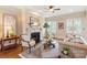 Cozy living room with a fireplace, hardwood floors, and comfortable seating at 9901 Strike The Gold Ln, Waxhaw, NC 28173