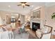 Inviting living room showcasing a fireplace, hardwood floors, and arched entryway at 9901 Strike The Gold Ln, Waxhaw, NC 28173
