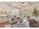Bright living room connected to the kitchen and dining area, perfect for entertaining at 9901 Strike The Gold Ln, Waxhaw, NC 28173