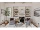 Cozy living room with custom built-ins and a fireplace at 9901 Strike The Gold Ln, Waxhaw, NC 28173