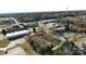 Aerial view of the property showing buildings, trees, parking areas, and surrounding buildings at 1056 Latham Ct # B104, Rock Hill, SC 29732