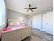 Comfortable bedroom featuring light gray walls, wood-look flooring, and double closets at 1056 Latham Ct # B104, Rock Hill, SC 29732