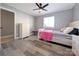 Cozy bedroom with a ceiling fan, wood-look flooring, and lots of natural light at 1056 Latham Ct # B104, Rock Hill, SC 29732