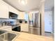 Modern kitchen featuring white cabinets, stainless appliances, and butcher block counters at 1056 Latham Ct # B104, Rock Hill, SC 29732
