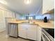 Bright kitchen featuring white cabinets, stainless appliances, and a breakfast bar at 1056 Latham Ct # B104, Rock Hill, SC 29732