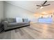 Spacious living room featuring wood-look floors and a comfortable gray sofa at 1056 Latham Ct # B104, Rock Hill, SC 29732