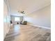 Bright, open-concept living room featuring wood-look floors and lots of natural light at 1056 Latham Ct # B104, Rock Hill, SC 29732