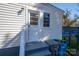 Cozy home backyard shows entrance, stairs to the backyard and garbage containers at 116 Garrison Dr, Belmont, NC 28012