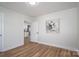 Inviting bedroom with neutral paint, wood-look flooring, and plenty of sunlight at 116 Garrison Dr, Belmont, NC 28012