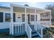 Charming single-story home with a covered front porch, gray shutters, and landscaped yard at 116 Garrison Dr, Belmont, NC 28012