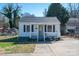 Charming single-story home with a covered front porch, gray shutters, and landscaped yard at 116 Garrison Dr, Belmont, NC 28012