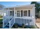 Charming single-story home with a covered front porch, gray shutters, and landscaped yard at 116 Garrison Dr, Belmont, NC 28012