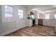 Open kitchen boasts stainless steel appliances, granite countertops, and natural light at 116 Garrison Dr, Belmont, NC 28012