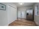 Bright kitchen features stainless steel refrigerator, wood-look flooring, and access to the backyard at 116 Garrison Dr, Belmont, NC 28012