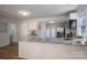 Modern kitchen featuring granite countertops, stainless steel appliances, and white cabinetry for a contemporary look at 116 Garrison Dr, Belmont, NC 28012