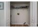 Spacious laundry room with storage shelf and utility connections, great for home maintenance at 116 Garrison Dr, Belmont, NC 28012