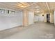 Unfinished basement with painted walls, drop ceiling, and a closet at 121 Ne 33Rd Ave, Hickory, NC 28601