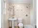 Retro white tile bathroom with vanity sink and shower at 121 Ne 33Rd Ave, Hickory, NC 28601
