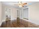 Bedroom with closet, ceiling fan, and adjacent tiled bathroom at 121 Ne 33Rd Ave, Hickory, NC 28601
